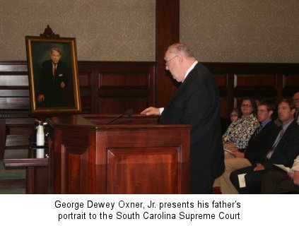 George Dewey Oxner presents his father's portrait to the Court